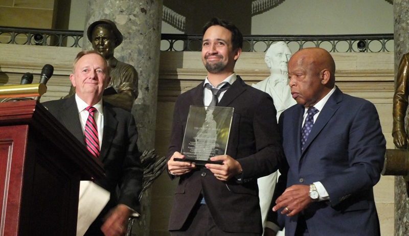 Playwright Lin-Manuel Miranda receiving the 2017 Freedom Award from 2014 recipient, Congressman John Lewis